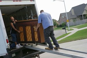 Unloading a piano on a wheeled sled and ramp | Britannia Alan Cook