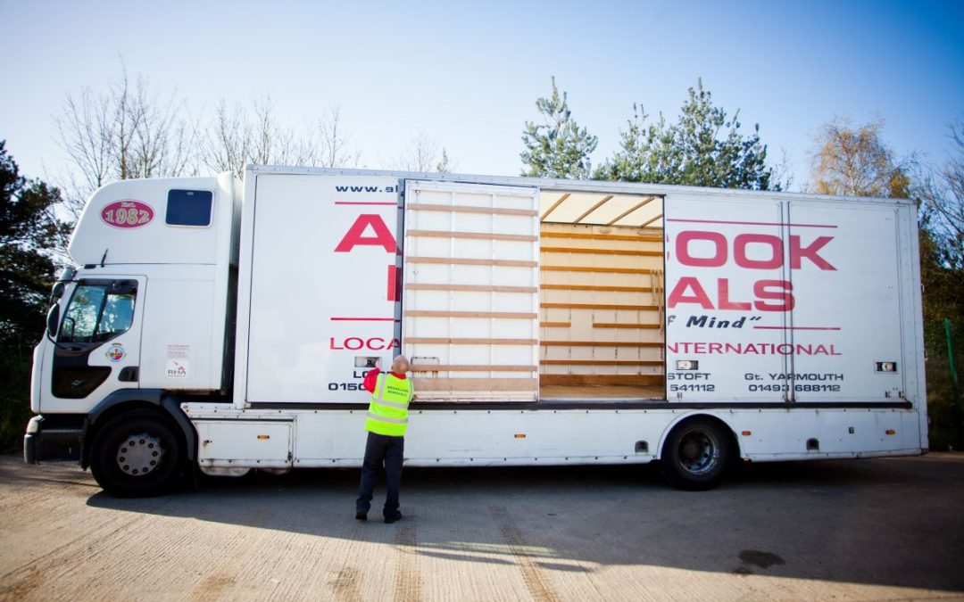 Britannia Alan Cook Removals Team opening the side doors of a lorry to start loading