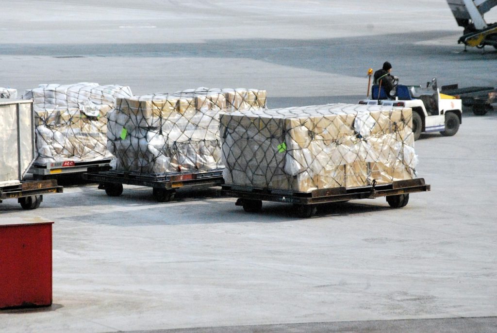 A bulk of packages being carried and delivered