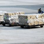 A bulk of packages being carried and delivered
